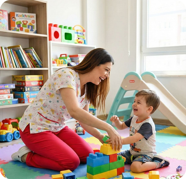 Speech therapist playing with a young child using colorful building blocks during a therapy session.